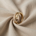 Gold-coloured Ring with sparkling stone setting and wrap design