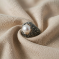 Dome Ring with Delicate Floral Pattern and Blue-White Moonstone Shimmer