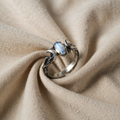 Ring with Crescent Moons and Oval Crystal
