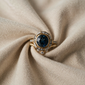 Gold-Coloured Ring with Blue Centre Stone and Cubic Zirconia