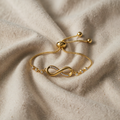 Adjustable “Infinity” Bracelet in Silver Tone.