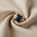 Gold-Coloured Ring with Blue Navette Stone and Crystals