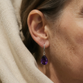 Silver-coloured earrings with purple drop pendant