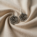 Silver-coloured drop earrings with open spiral rings