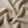 Elegant black oval white gold necklace