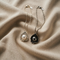 Necklace with pearl and shell chains with shiny pearl