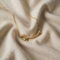 Gold Stylised Dog Pendant with Shimmering Gold Surface