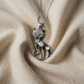 Silver cat pendant with inlaid Zircon stones