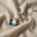 Necklace with rainbow heart wings and paw
