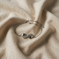 Bracelet with Eternity Symbol and Paw Print Charm