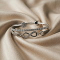 Bracelet set with rhinestones in white gold and infinity design