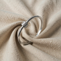 Silver-coloured bracelet with cubic zirconia rings