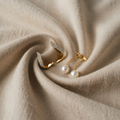 Elegant pearl pendants in gold earrings