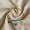 Ula – Bracelet with Blue Eye and Charms