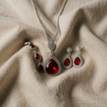 White Gold Jewellery Set Featuring Radiant Ruby Centrepiece